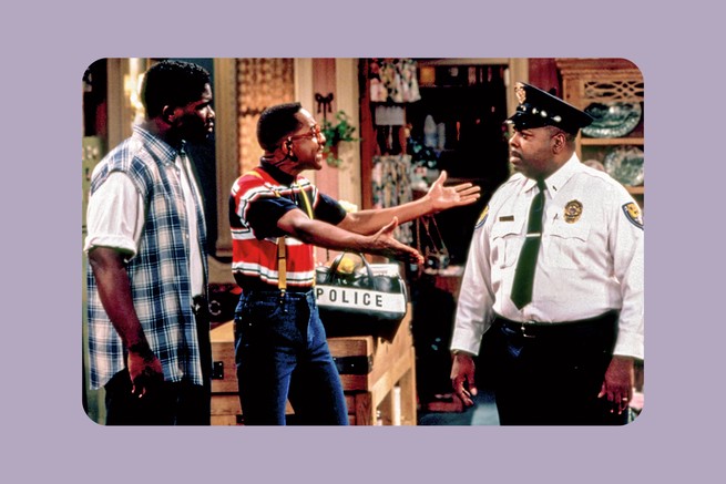 Still from 'Family Matters' with characters Eddie Winslow, Steve Urkel with arms extended, and Carl Winslow in uniform.