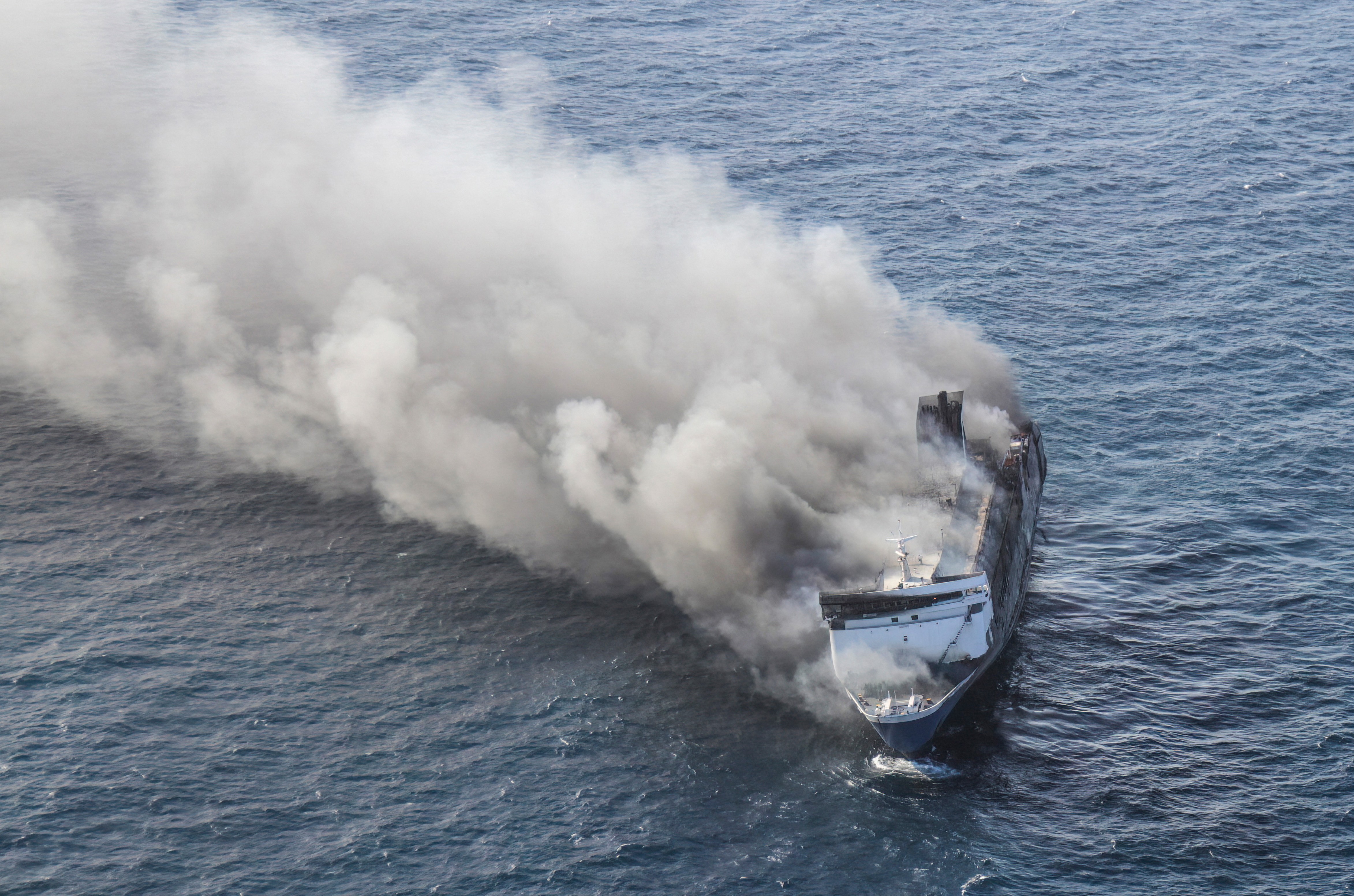 Smoke rises from a burning passenger ferry.
