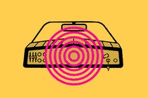 A car dashboard with a many-ringed hot-pink circle in the middle, all against a yellow background