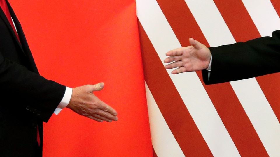 Photo showing Xi and Trump shaking hands
