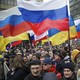 Demonstrators hold Russian and Ukrainian flags.