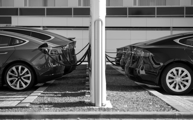 Five Tesla electric cars are shown charging in the Netherlands.