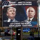 Pedestrians cross the street behind a billboard showing a pictures of President Trump and Russian President Vladimir Putin.