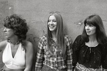 The three members of the Shangri-Las standing in front of a wall