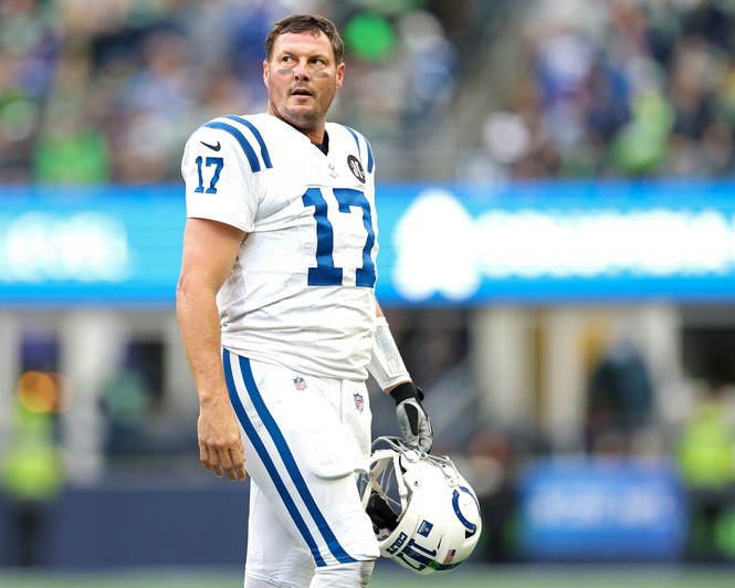 Riners on the field with his helmet off