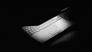 Illustration of a half-closed laptop with a flickering screen light