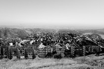 The Hollywood sign seen from behind in black and white