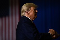 Former President Donald Trump claps during a Save America rally in Warren, Michigan, on October 1, 2022.