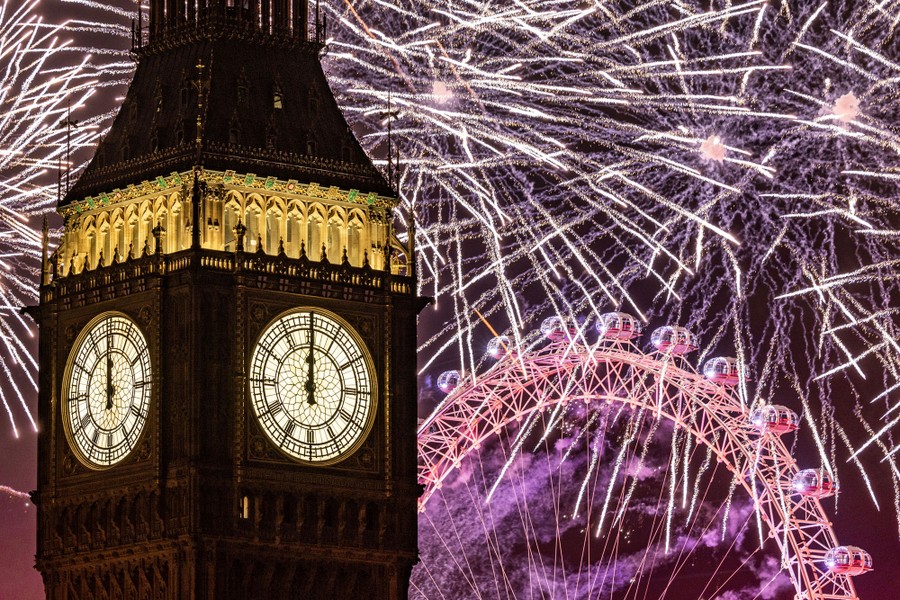Fireworks light up the London skyline over Big Ben and the London Eye.