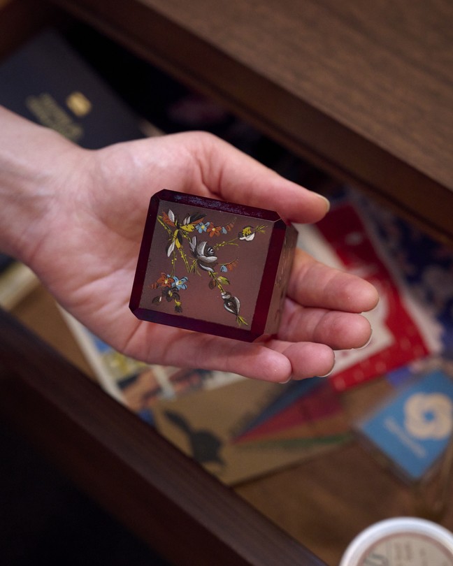Picture of a person holding a paperweight