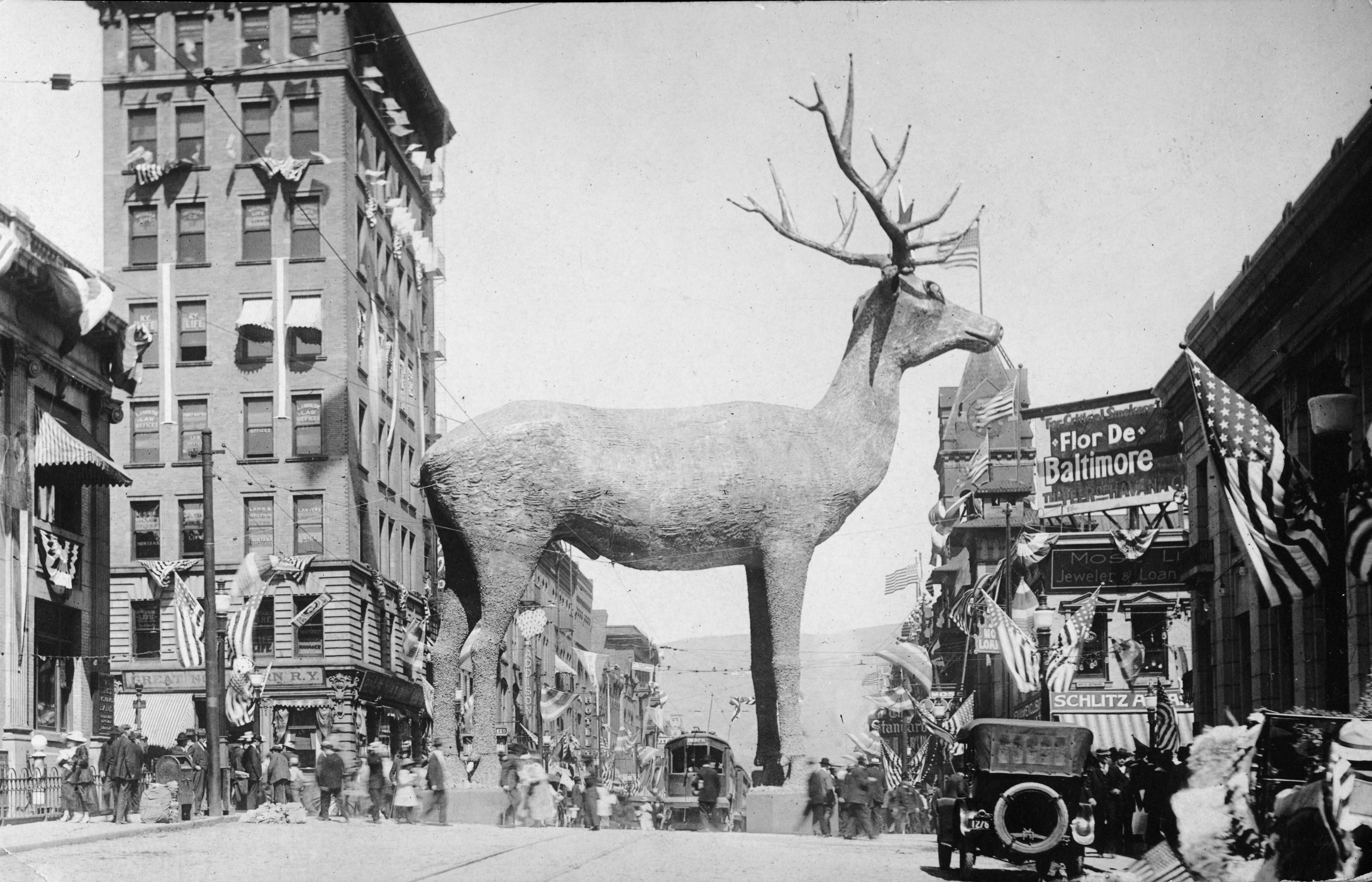 A 62-foot-tall copper-plated elk statue stands in a busy intersection in downtown Butte, Montana, in 1916.
