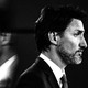 Justin Trudeau in profile with his blurred mirror image behind him