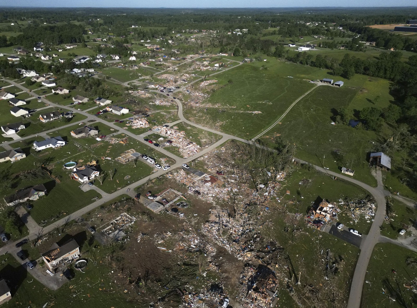 An aerial view of debris and destroyed homes left in the path of a tornado