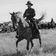 Still of Paul and George on horseback in "The Power of the Dog"