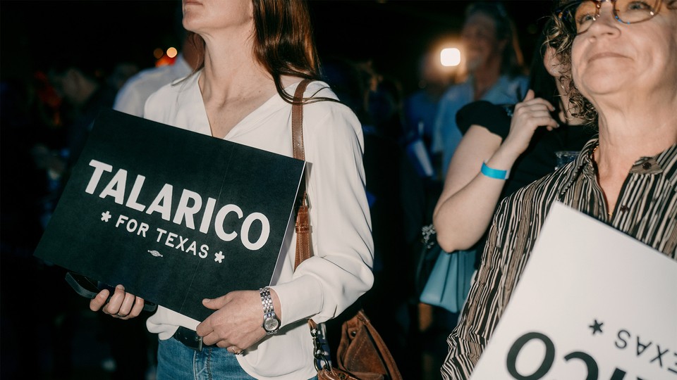Two women holding "Talarico for Texas" signs