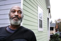 Man in front of home