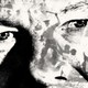 A close-up of a white apartheid leader's face on which scenes of apartheid-era violence are projected