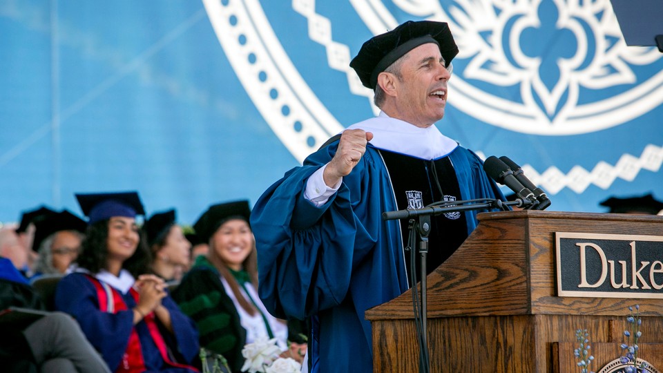 Jerry Seinfeld speaking at a Duke podium