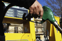 An image of a person holding a gas pump.