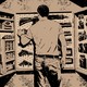A man in a shadowy room reaching into a wall-mounted gun cabinet