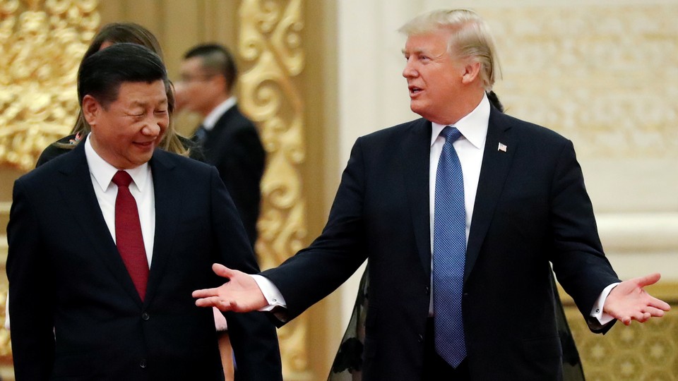 Donald Trump and Xi Jinping meet in Beijing in 2017.