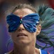 A runner wears a butterfly-shaped blindfold while competing at the Paralympic Games.
