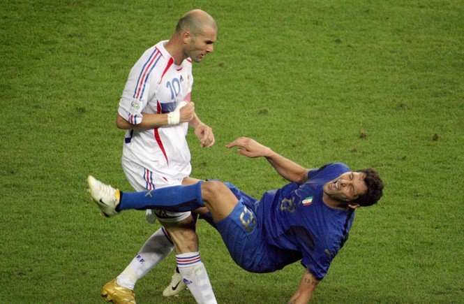 A photo taken 09 July 2006 shows French midfielder Zinedine Zidane (L) gesturing after head-butting Italian defender Marco Materazzi during the World Cup 2006 final football match between Italy and France at Berlins Olympic Stadium. 