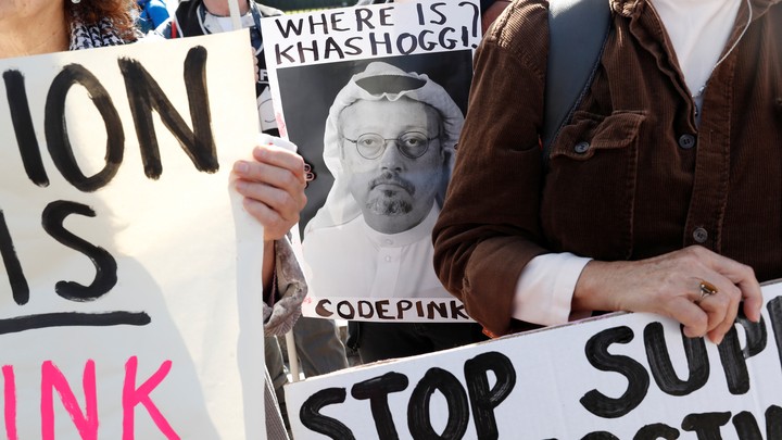 Demonstrators outside of the White House on October 19, 2018