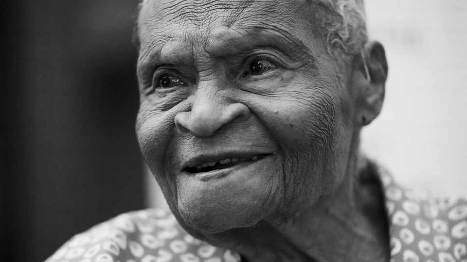 Black-and-white photograph of an elderly Black woman