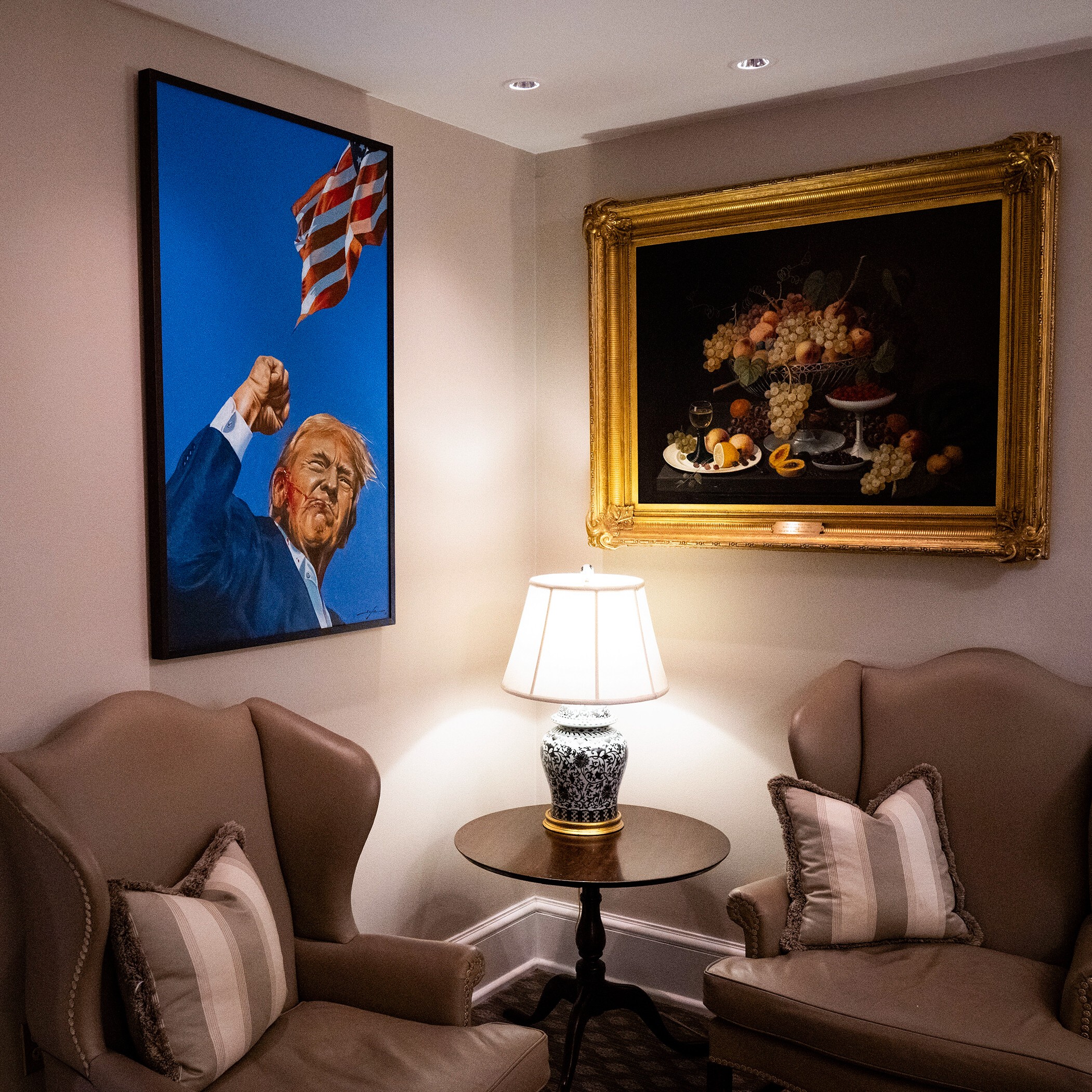 a room interior and a painting of Donald Trump bleeding and raising his fist 