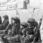Israeli soldiers sit in front of the Western Wall in Jerusalem's Old City.