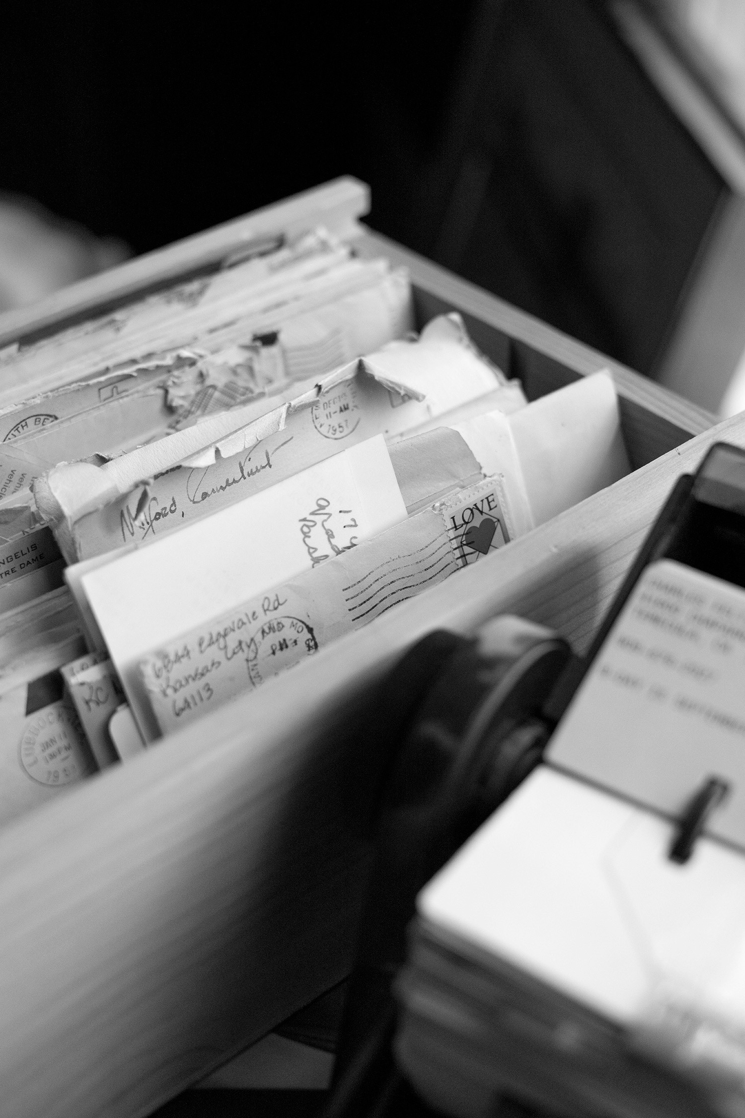 A black and white photo of a box of letters