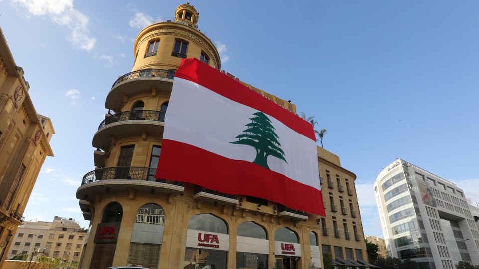 A Lebanese flag hangs from a building in downtown Beirut.