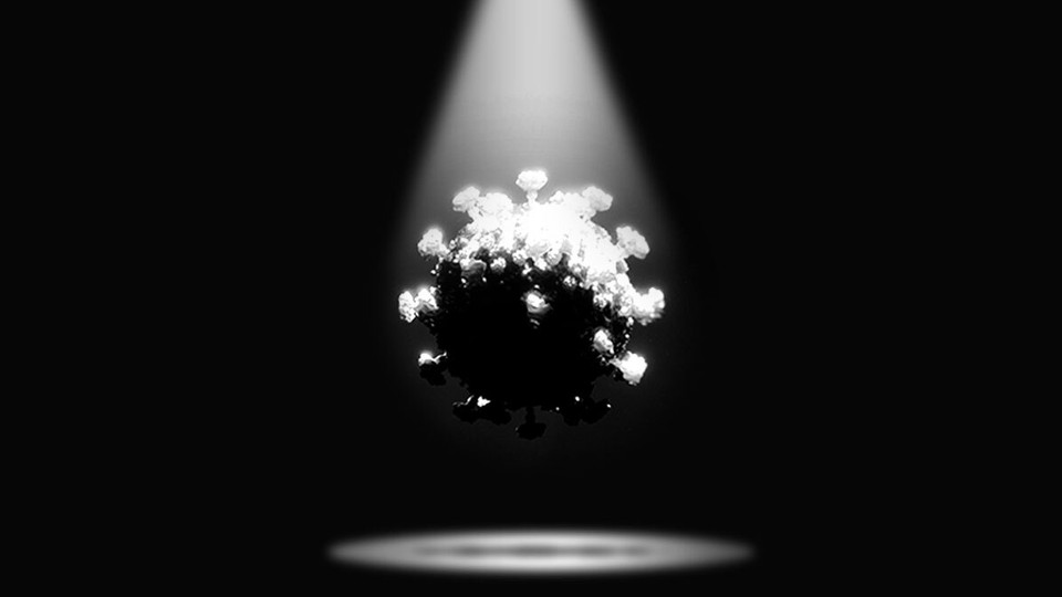 A coronavirus in a spotlight, shadowed