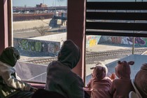 Migrants from Venezuela, who had their asylum appointments with U.S. officials cancelled hours after President Donald Trump's inauguration, look out at the closed border with the U.S. from a government-run shelter in Juarez, Mexico, on January 21.