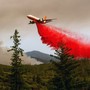 An air tanker drops retardant while battling the Ferguson Fire in the Stanislaus National Forest, near Yosemite National Park, California, on July 21, 2018.