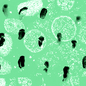 Some black smudges on a green background with white blobs