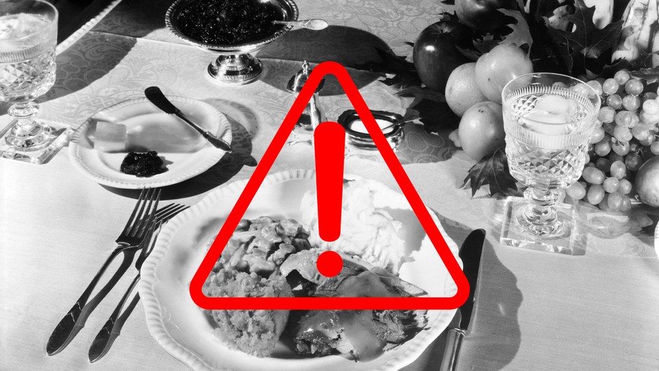A Thanksgiving meal with a warning sign superimposed over it
