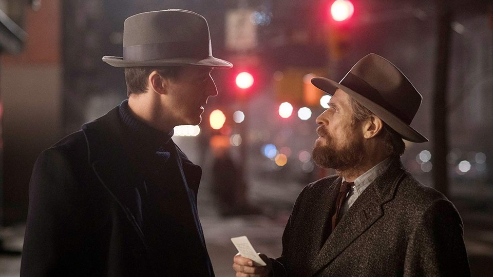 A still from the movie 'Motherless Brooklyn' of characters in conversation