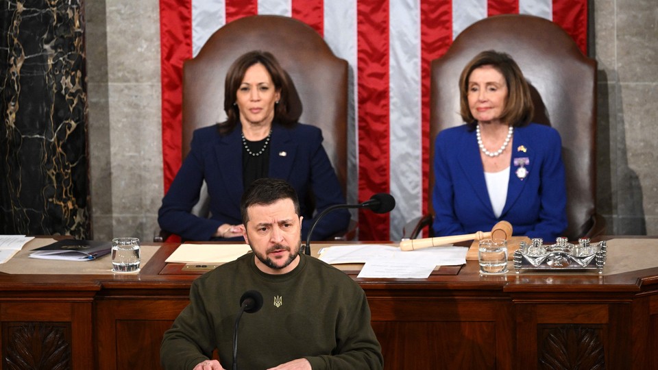 Volodymyr Zelensky addressing Congress in Washington, DC on December 21, 2022 in from of Kamala Harris and Nancy Pelosi