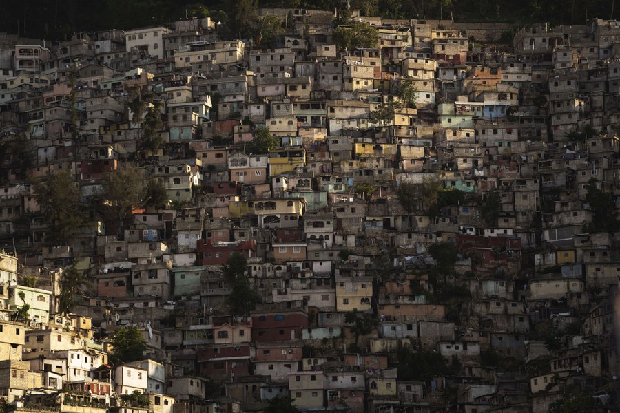 Closely built small houses cover a hillside in Haiti.