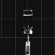 A graphic illustration showing a black-and-white photo of a syringe and a vial over a black-grid background