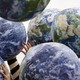 People hold up inflatable world globes during World Environment Day celebrations in central Sydney June 5, 2009.