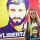 Lilian Tintori, wife of jailed Venezuelan opposition leader Leopoldo Lopez, poses for a picture in front of a poster depicting her husband.