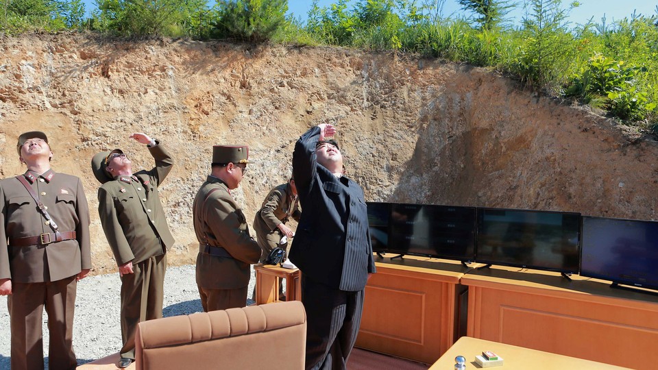 North Korean leader Kim Jong Un looks on during the test-launch of the intercontinental ballistic missile Hwasong-14 in an undated photo released by North Korea's Korean Central News Agency (KCNA).