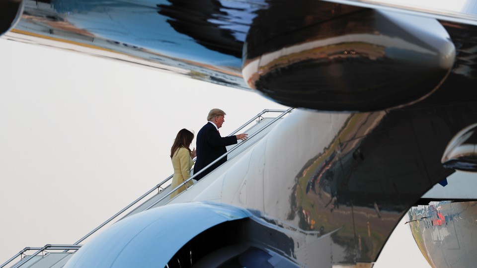 Donald and Melania Trump board Air Force One after the summit in Helsinki
