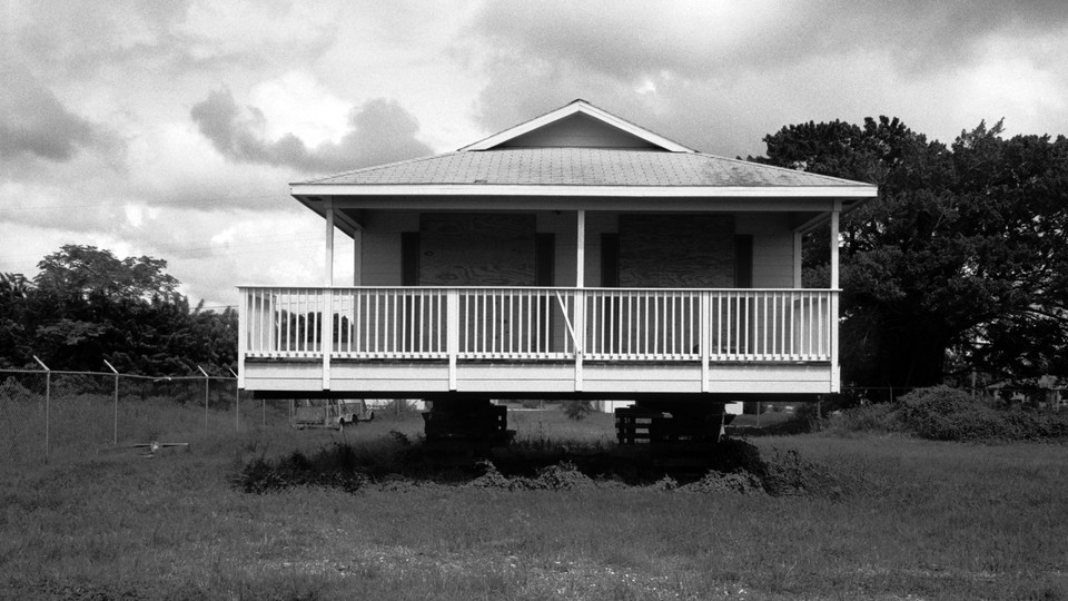 A foreclosed house stands vacant and boarded up in Fort Myers, Florida, in this photo taken during the 2008 recession