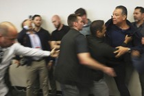 An image of Alex Padilla being forcibly removed