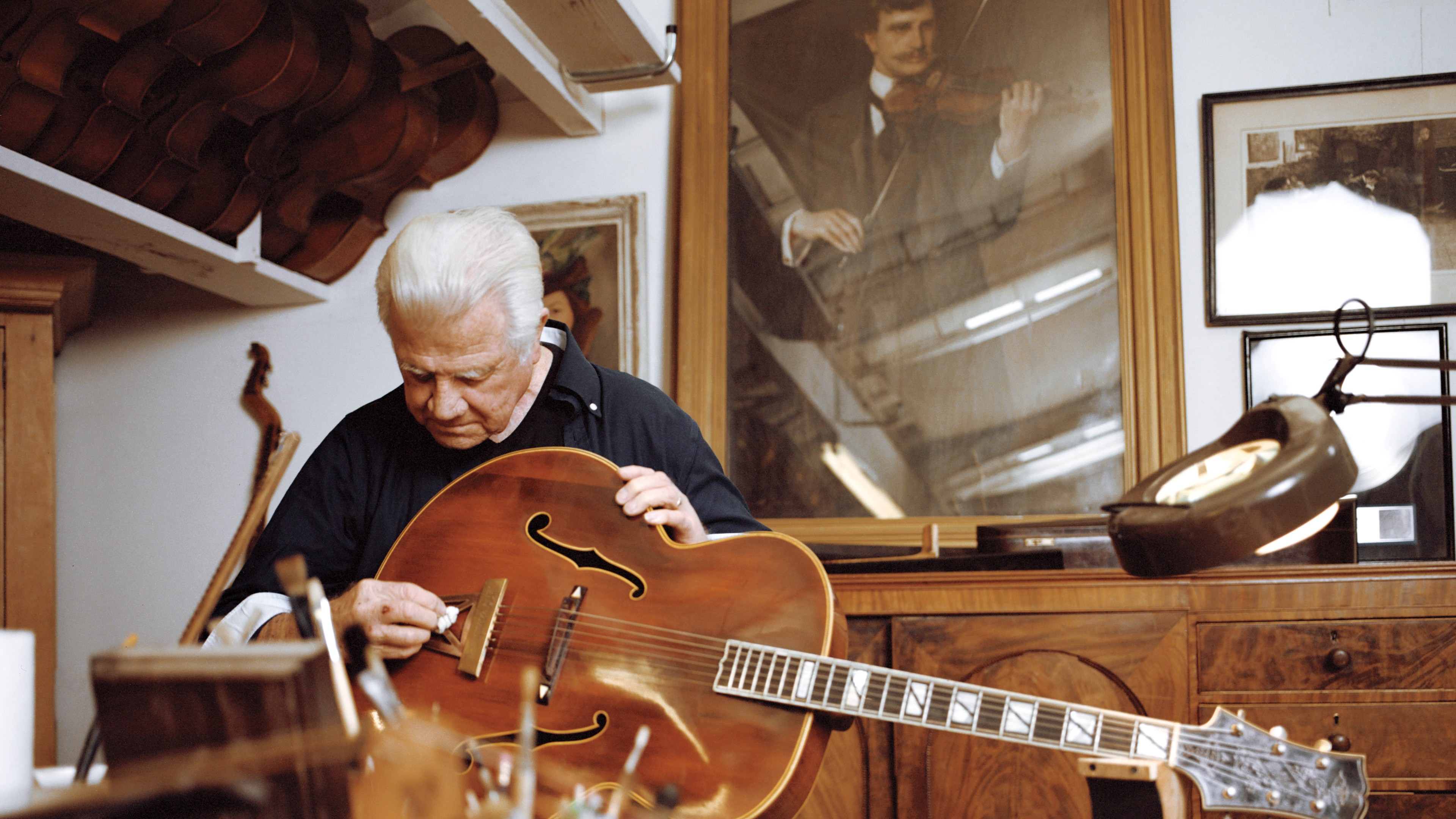 picture of Fred Walecki cleaning a guitar