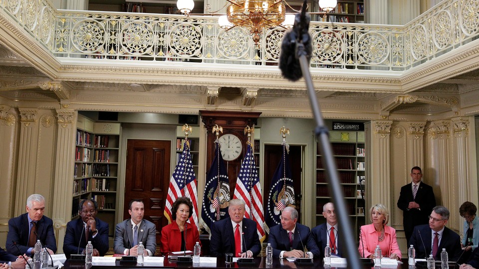 President Trump meets with his strategic and policy council in Washington in April.